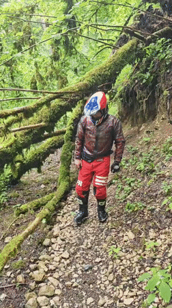 Motorcyclists document forest waterfall excursion near Lesnoe, Russia
