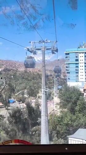 Cable car ride filmed over La Paz cityscape