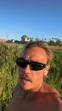 Blonde jogger spotted running through Mengwi grassland