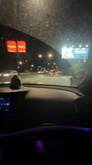 Evening car journey documented through central Tbilisi