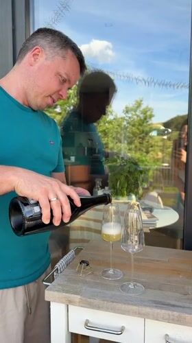 Outdoor champagne and charcuterie gathering with dog in Gangloff