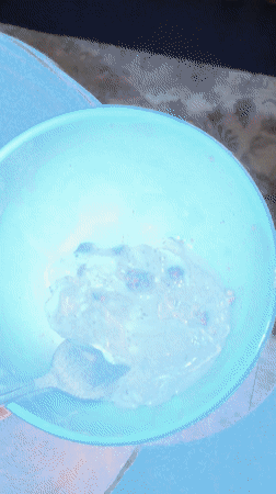 Person enjoys chocolate chip ice cream in Mishutkino