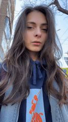 Woman Takes Late Night Selfies Using Storefronts in Krasnoyarsk