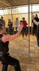 Wedding celebration with dancing and decorated car in Russian village