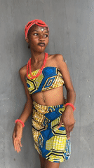 Woman poses in traditional African dress in Badagry