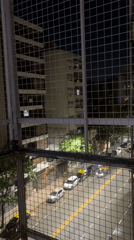 Nighttime street scene observed from balcony in Buenos Aires
