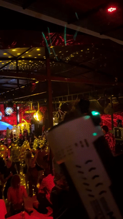 Indoor party documented with lighting effects in Thailand