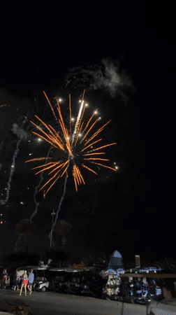 Fourth of July fireworks over a decorated Surfside Beach house