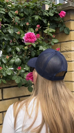 Woman in blue cap observed during routine activities in Sirius, Russia