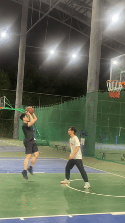 Young men play casual basketball game in Chongqing