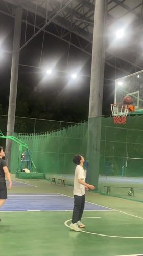 Young men play casual basketball game in Chongqing