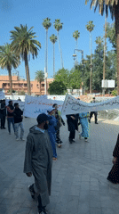 Workers in green uniforms stage May Day protest in Marrakesh