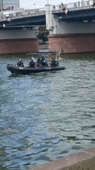 Dragon boat race on the Main River with police presence