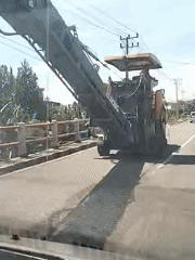 Industrial milling machine crosses bridge in Jurong Pandee, Indonesia