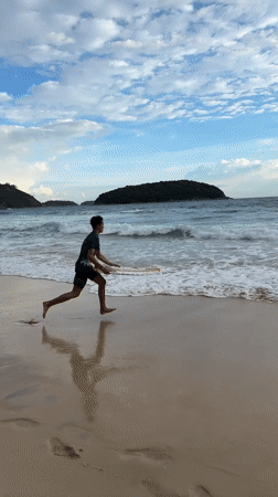 Beach day with double rainbow captured at Rawai, Thailand