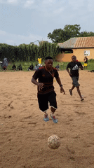 Informal soccer match draws players, spectators in Nigerian village