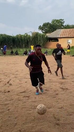 Informal soccer match draws players, spectators in Nigerian village