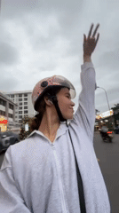Woman rides scooter through Nha Trang streets