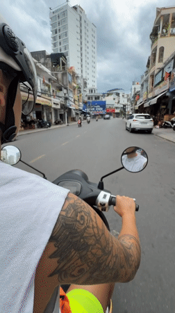 Scooter POV through Nha Trang streets on a cloudy morning