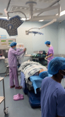 Medical staff observed in operating room, Yuzhong District