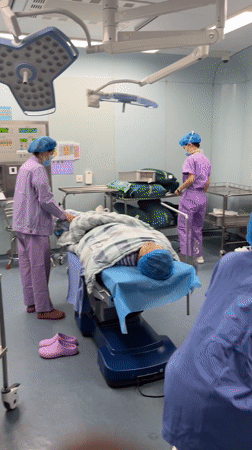 Medical staff observed in operating room, Yuzhong District