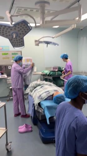 Medical staff observed in operating room, Yuzhong District