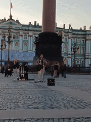 Street musician performs at St. Petersburg's Palace Square