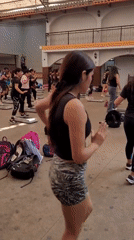 Aerobics step class in session at an open-air Lima gym