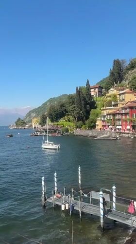 Tourists enjoy sunny afternoon at Lake Como's Varenna