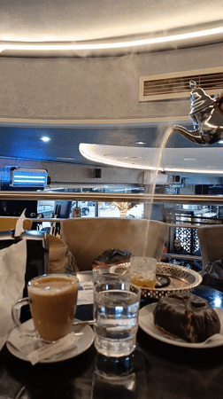 Motorcyclist documents cafe stop and street journey through Meknes