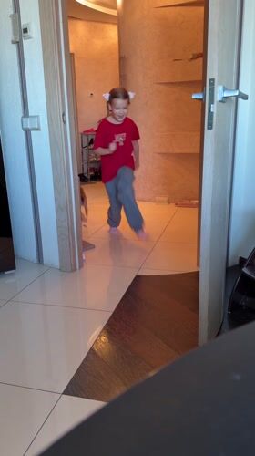 Child plays with cats and toy figurines in Murino home
