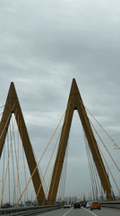 Vehicle crosses cable-stayed bridge during morning traffic in Kazan