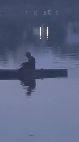 Evening fisher spotted in misty waters near Lhokseumawe