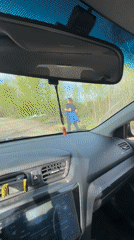 Driver encounters jogger on dirt road in Chaikovsky