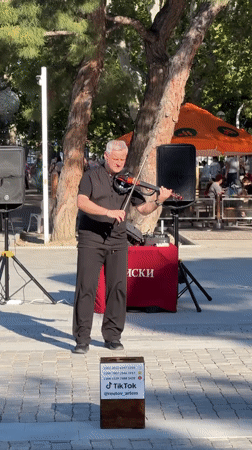 Summer afternoon unfolds along Gelendzhik Bay waterfront promenade