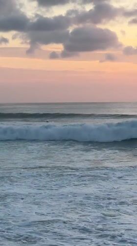 Sunset beach life captured at Kuta Selatan, Indonesia