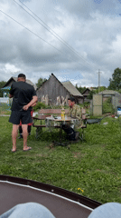Rural gathering with dog captured in Zhigalki backyard