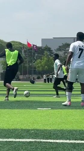 Men play casual soccer match in Linghe, China