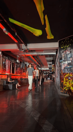 Underground fashion show in a graffiti-lined Milan venue