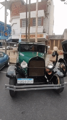 Classic car display features 1929 Ford, Corvette