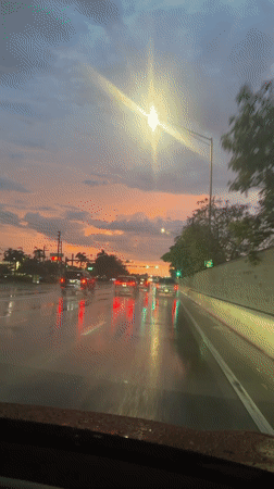 Wet roads and a vivid sunset sky in Pompano Beach
