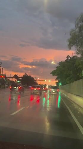 Wet roads and a vivid sunset sky in Pompano Beach