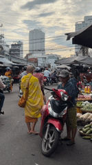 Morning market hustle in Nha Trang, monks and vendors included.