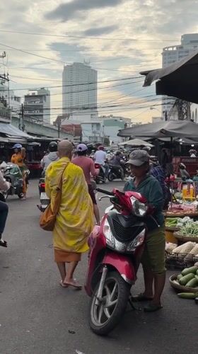 Morning market hustle in Nha Trang, monks and vendors included.