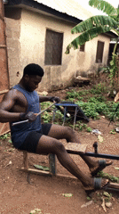 Man exercises on homemade rowing machine in Akwanga