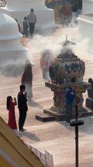 Religious gathering with incense ceremony observed in Kathmandu courtyard