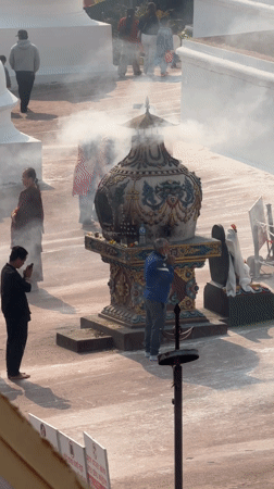 Religious gathering with incense ceremony observed in Kathmandu courtyard