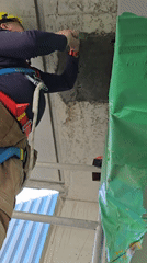 Construction worker performs early morning maintenance work