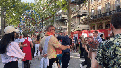 Public dancing event draws diverse crowds to Paris courtyard