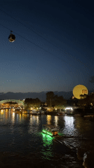 Twilight scenes captured along Tbilisi river near historic landmarks